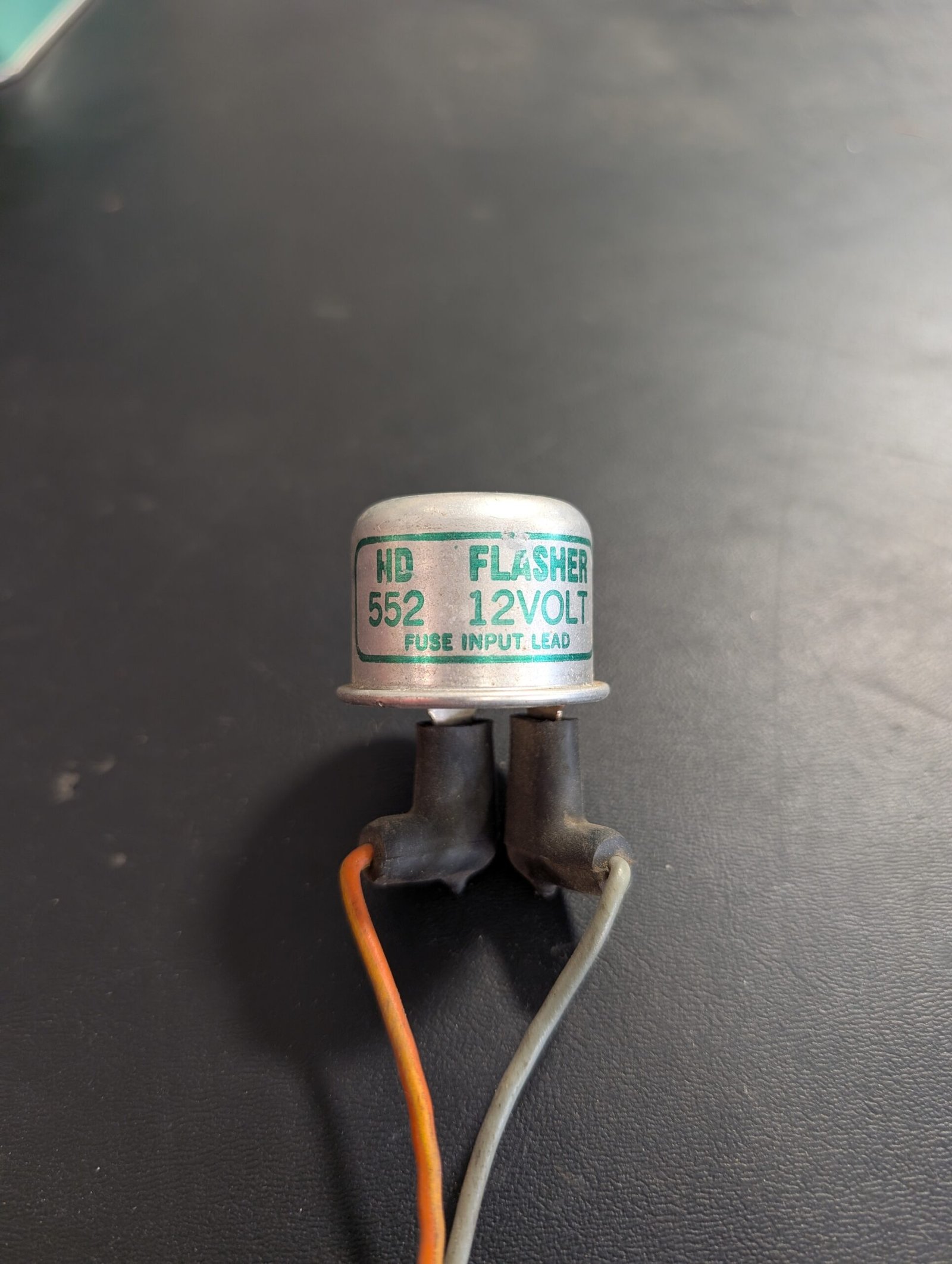 Old-school two-prong OEM thermal turn signal flasher for a classic car